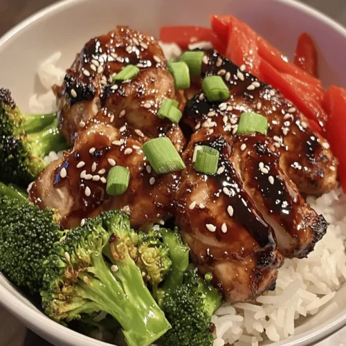 The Savory Teriyaki Chicken Rice Bowl is a beloved dish that has earned its place in the hearts and stomachs of many, celebrated for its vibrant flavors and satisfying components. Originating from Japanese cuisine, teriyaki dishes are known for their umami-rich sauces that glaze meats and vegetables, creating a mouthwatering experience in every bite. The combination of tender chicken, fluffy rice, and a flavorful sauce makes this dish a staple not just in Asian households but also in kitchens around the world.